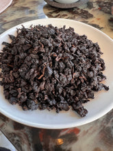 Load image into Gallery viewer, Exoteaque x ANMO Iron Goddess - taiwenese Tanbei ( charcoal baked ) Oolong - signature Collectors edition